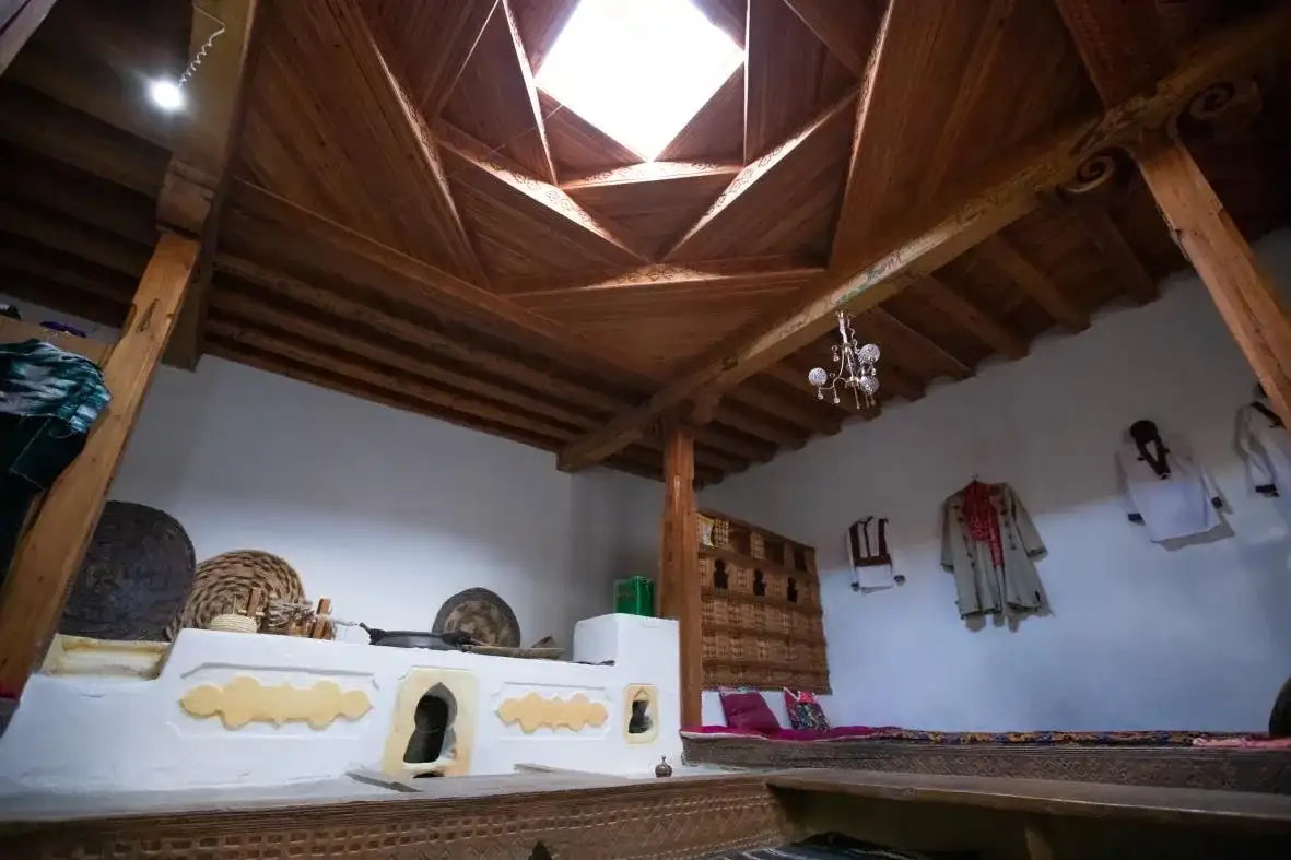 The carved skylight ceiling of a traditional Pamiri house near the Buddhist stupa
