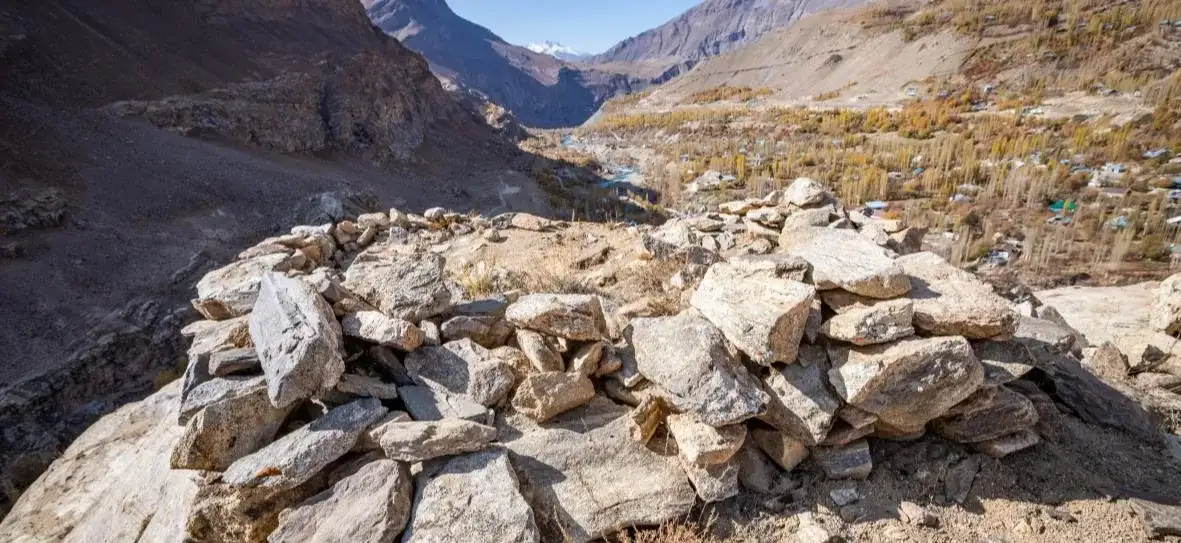 The mountain road descending from the Koitezak pass into a Pamir valley
